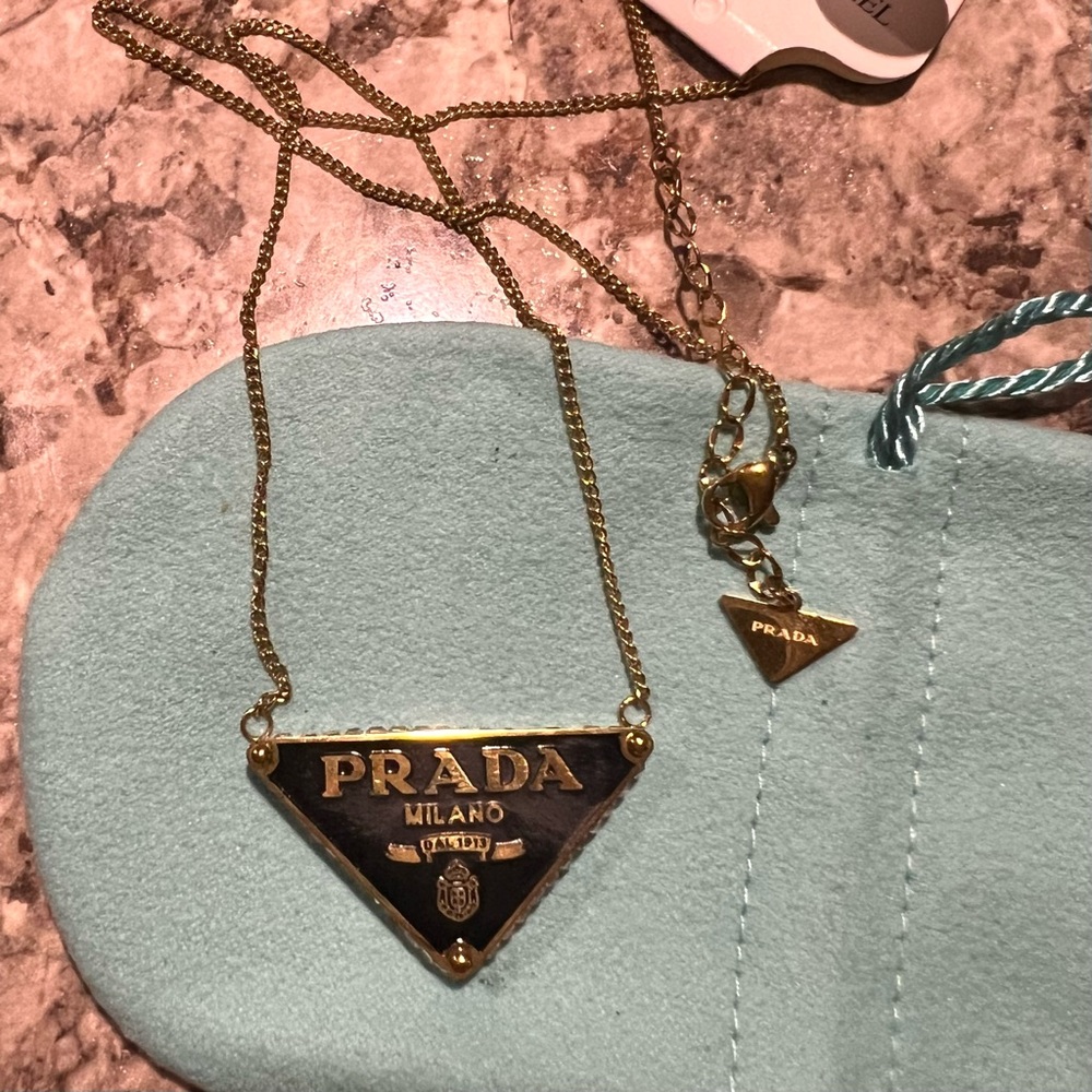 Prada Black and Gold Triangle Logo Necklace